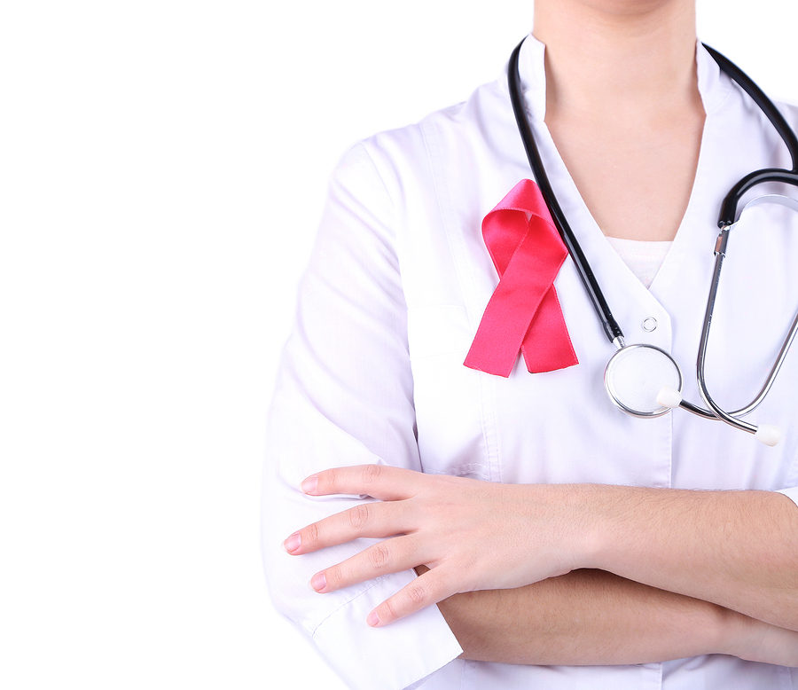 Doctor  with ribbon formed Aids symbol, close-up, isolated on wh